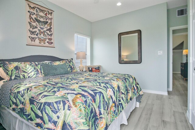 1214 Hwy 87, Gilchrist, TX 77617 - bedroom featuring wood finished floors and baseboards