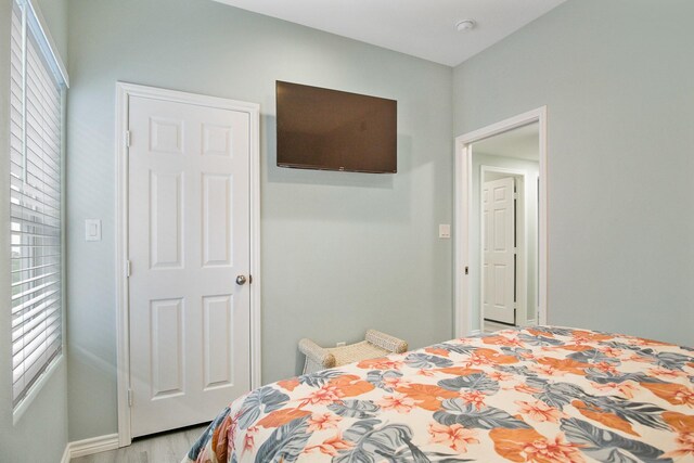 1214 Hwy 87, Gilchrist, TX 77617 - bedroom featuring light wood-style floors