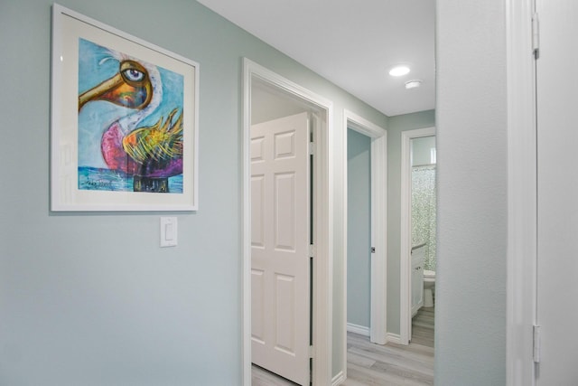 1214 Hwy 87, Gilchrist, TX 77617 - hall featuring light wood-style floors and baseboards