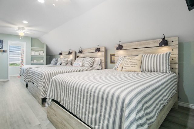 1214 Hwy 87, Gilchrist, TX 77617 - bedroom featuring baseboards, wood finished floors, ceiling fan, recessed lighting, and vaulted ceiling