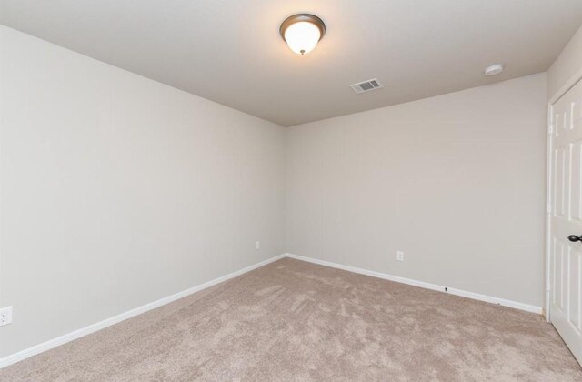 5918 Bright Keel Dr, Katy, TX 77493 - unfurnished room featuring carpet flooring, baseboards, and a smoke detector