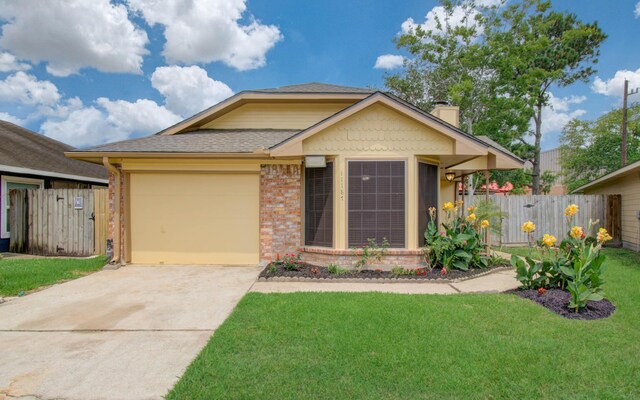 11187 Thunderhaven Dr, Houston, TX 77064 - view of front of home featuring driveway, an attached garage, brick siding, roof with shingles, and a chimney