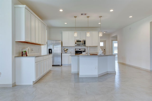 29751 Cayenne Cir, Katy, TX 77494 - kitchen with stainless steel appliances, tasteful backsplash, recessed lighting, and white cabinetry