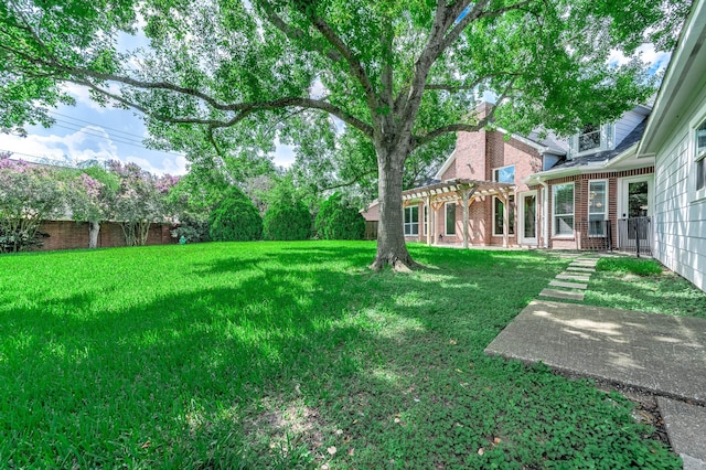 8903 Loch Lomond Ct, Houston, TX 77096 - view of green lawn with a pergola