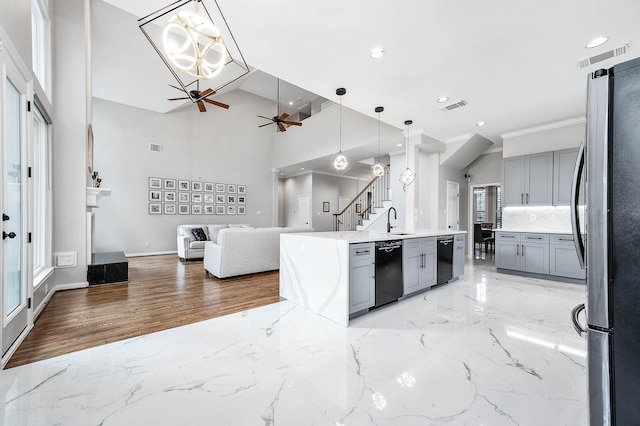 8903 Loch Lomond Ct, Houston, TX 77096 - kitchen with freestanding refrigerator, ceiling fan, gray cabinets, open floor plan, and a sink