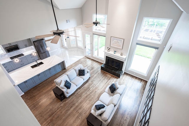 8903 Loch Lomond Ct, Houston, TX 77096 - living room with ceiling fan, high vaulted ceiling, and wood finished floors