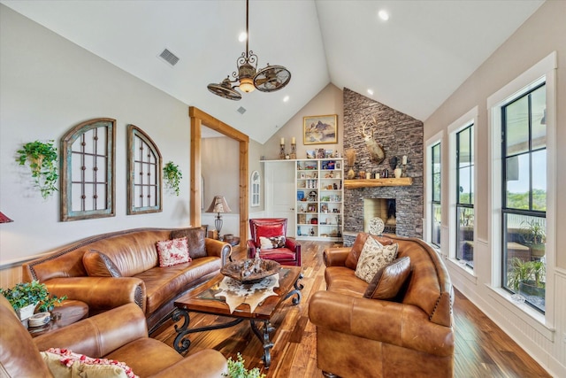 1932 Chappell Ridge Ln, Chappell Hill, TX 77426 - living area featuring wood finished floors, high vaulted ceiling, a fireplace, and recessed lighting