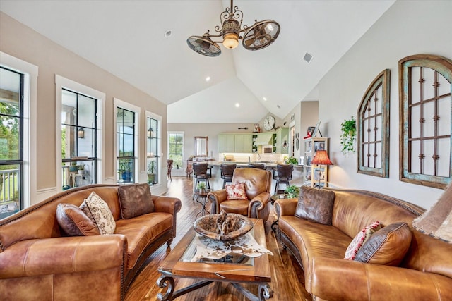 1932 Chappell Ridge Ln, Chappell Hill, TX 77426 - living area with wood finished floors, lofted ceiling, a chandelier, and recessed lighting