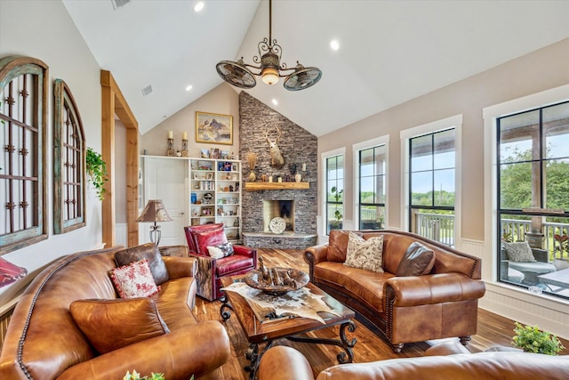 1932 Chappell Ridge Ln, Chappell Hill, TX 77426 - living area featuring wood finished floors, high vaulted ceiling, a fireplace, and recessed lighting