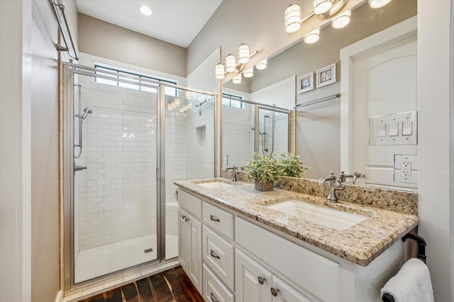1932 Chappell Ridge Ln, Chappell Hill, TX 77426 - bathroom with double vanity, a stall shower, and wood finished floors
