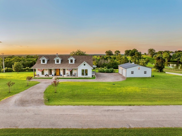 1932 Chappell Ridge Ln, Chappell Hill, TX 77426 - view of front of property with a porch, an outbuilding, a front yard, and driveway