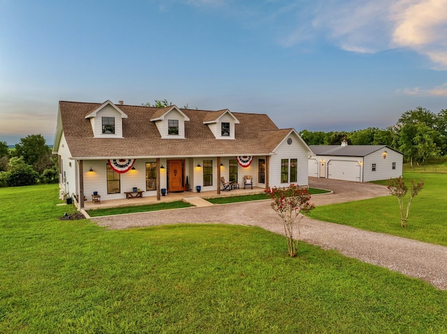 1932 Chappell Ridge Ln, Chappell Hill, TX 77426 - cape cod-style house featuring driveway, covered porch, a lawn, and a detached garage