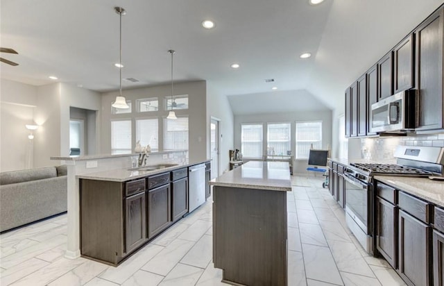 20910 Big Cypress Creek Trl, Humble, TX 77338 - kitchen with stainless steel appliances, a kitchen island with sink, a sink, open floor plan, and recessed lighting
