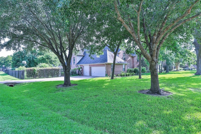2107 N Shadow Grove Ln, Richmond, TX 77406 - view of yard featuring driveway and a garage