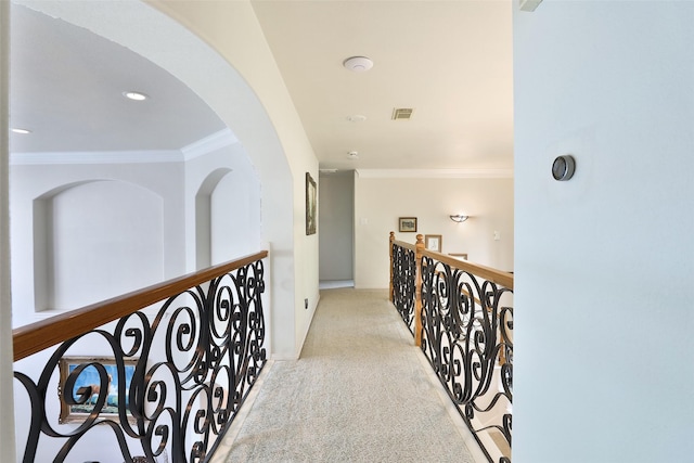 2107 N Shadow Grove Ln, Richmond, TX 77406 - corridor with crown molding, carpet floors, baseboards, and arched walkways