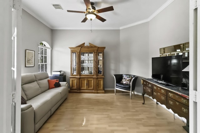 2902 Sycamore Tree Ct, Houston, TX 77345 - living room with a ceiling fan, ornamental molding, light wood-type flooring, and baseboards