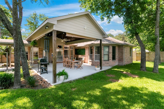 2902 Sycamore Tree Ct, Houston, TX 77345 - rear view of house with a ceiling fan, brick siding, and a patio
