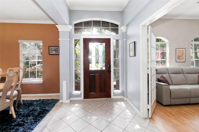 2902 Sycamore Tree Ct, Houston, TX 77345 - foyer entrance featuring light tile patterned floors, crown molding, and baseboards