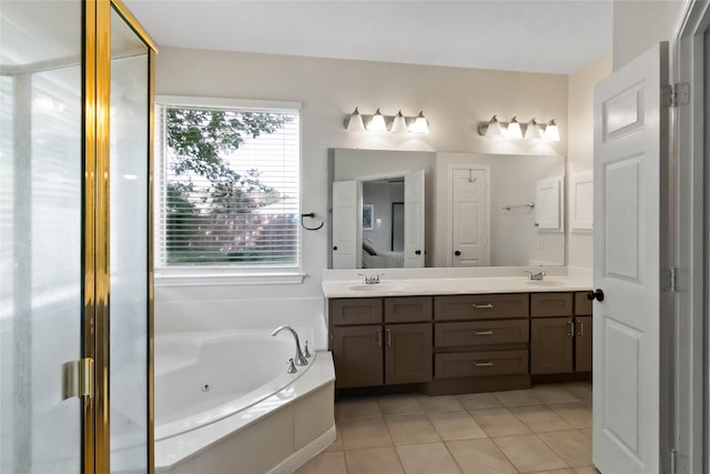 2902 Sycamore Tree Ct, Houston, TX 77345 - bathroom featuring double vanity, a jetted tub, and tile patterned floors