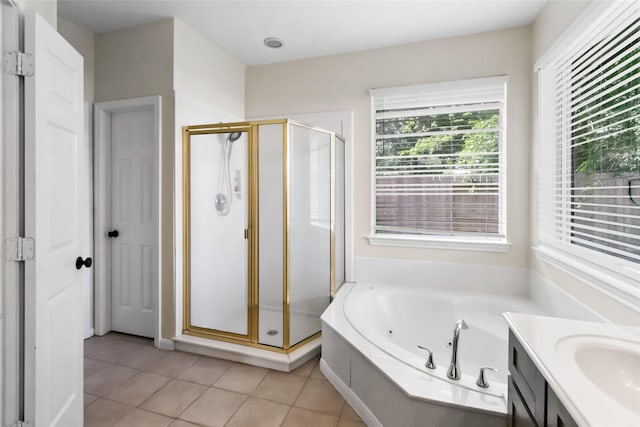2902 Sycamore Tree Ct, Houston, TX 77345 - full bath featuring a stall shower, a jetted tub, vanity, and tile patterned floors