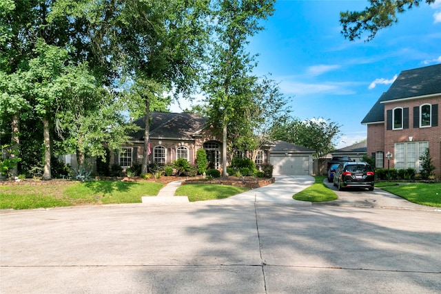 2902 Sycamore Tree Ct, Houston, TX 77345 - view of front of home featuring a garage, concrete driveway, and a front yard