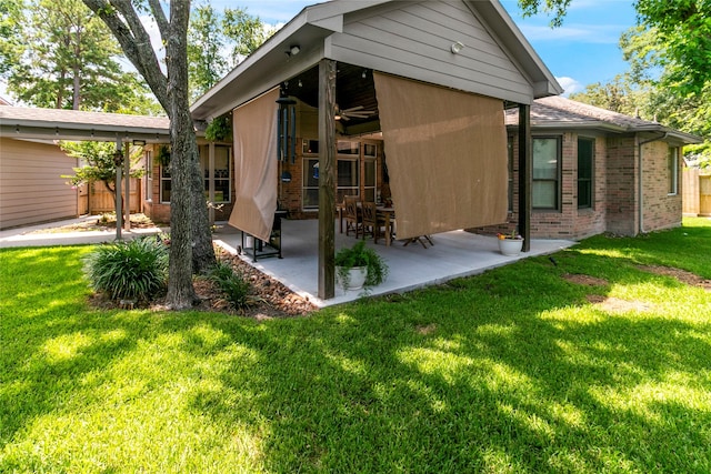 2902 Sycamore Tree Ct, Houston, TX 77345 - rear view of house featuring brick siding, a patio, a yard, and ceiling fan