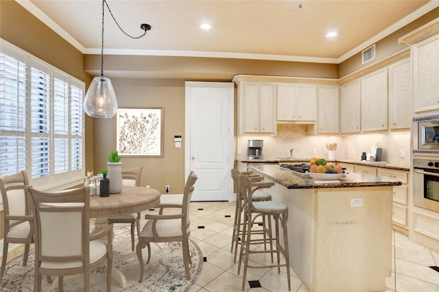 1210 Crocker St, Houston, TX 77019 - kitchen with stainless steel appliances, decorative backsplash, healthy amount of natural light, ornamental molding, and recessed lighting
