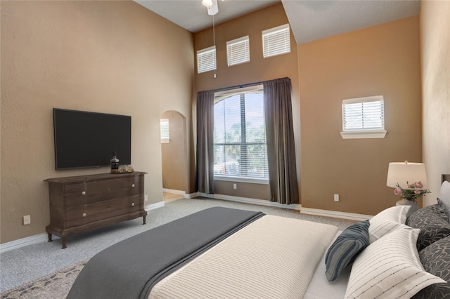 1210 Crocker St, Houston, TX 77019 - carpeted bedroom with arched walkways, baseboards, and a high ceiling