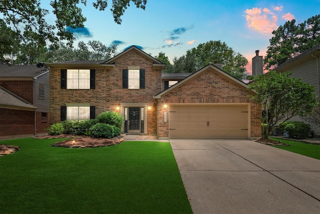 3802 Sweetgum Hill Ln, Kingwood, TX 77345 - view of front of home with brick siding, an attached garage, a front yard, and concrete driveway