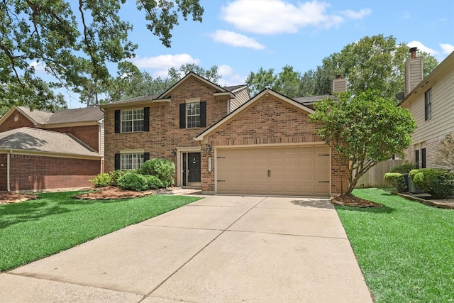 3802 Sweetgum Hill Ln, Kingwood, TX 77345 - traditional-style house with brick siding, a garage, driveway, and a front lawn