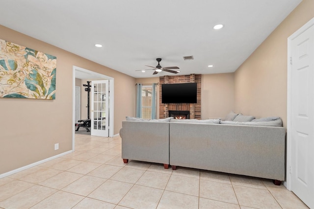 3802 Sweetgum Hill Ln, Kingwood, TX 77345 - living room featuring ceiling fan, recessed lighting, light tile patterned floors, a brick fireplace, and baseboards