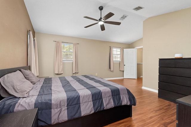 3802 Sweetgum Hill Ln, Kingwood, TX 77345 - bedroom featuring lofted ceiling, wood finished floors, baseboards, and a ceiling fan