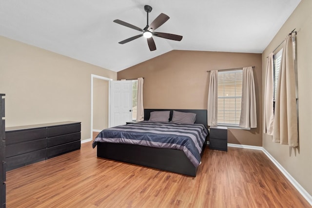 3802 Sweetgum Hill Ln, Kingwood, TX 77345 - bedroom with wood finished floors, lofted ceiling, baseboards, and ceiling fan