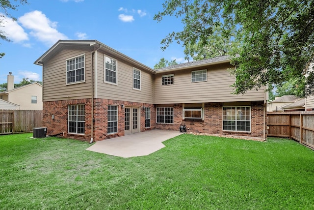 3802 Sweetgum Hill Ln, Kingwood, TX 77345 - back of property featuring brick siding, central air condition unit, and a patio area