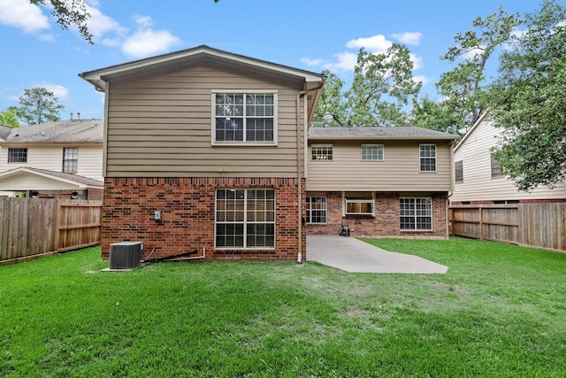 3802 Sweetgum Hill Ln, Kingwood, TX 77345 - rear view of house featuring central air condition unit, a patio area, and brick siding