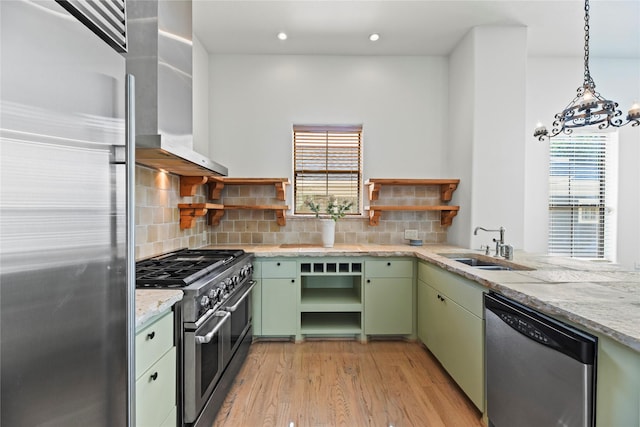 624 Harold St, Houston, TX 77006 - kitchen with open shelves, green cabinetry, appliances with stainless steel finishes, wall chimney exhaust hood, and recessed lighting