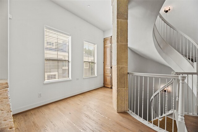 624 Harold St, Houston, TX 77006 - hall with vaulted ceiling, wood finished floors, and baseboards