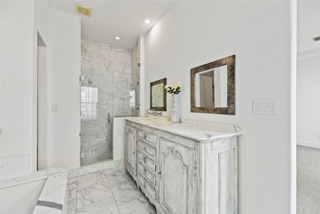 624 Harold St, Houston, TX 77006 - full bathroom featuring marble look tiles, a marble finish shower, double vanity, and recessed lighting