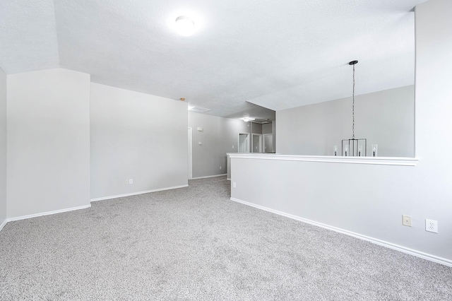 6701 Hidden Colony Ln, League City, TX 77539 - carpeted spare room featuring vaulted ceiling and a textured ceiling