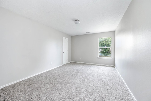 6701 Hidden Colony Ln, League City, TX 77539 - spare room featuring carpet flooring and a textured ceiling