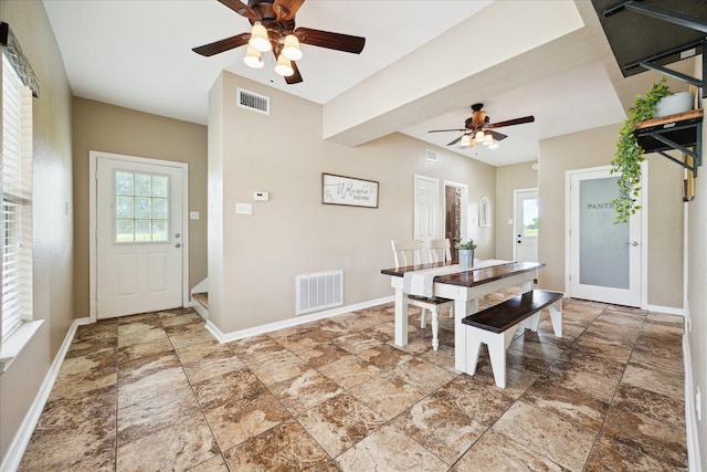 3415 Jack Beaver Rd, Santa Fe, TX 77517 - dining space with a ceiling fan, stone finish floors, healthy amount of natural light, and baseboards