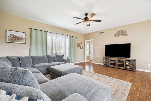 3415 Jack Beaver Rd, Santa Fe, TX 77517 - living area featuring wood finished floors, a ceiling fan, and baseboards