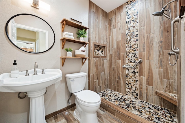 3415 Jack Beaver Rd, Santa Fe, TX 77517 - full bathroom featuring a tile shower and toilet