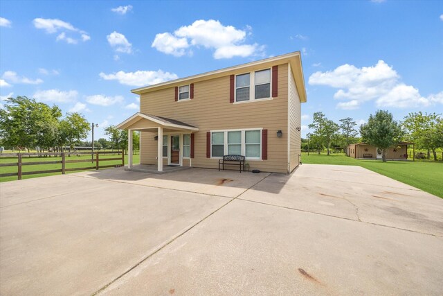 3415 Jack Beaver Rd, Santa Fe, TX 77517 - rear view of property featuring driveway and a patio area