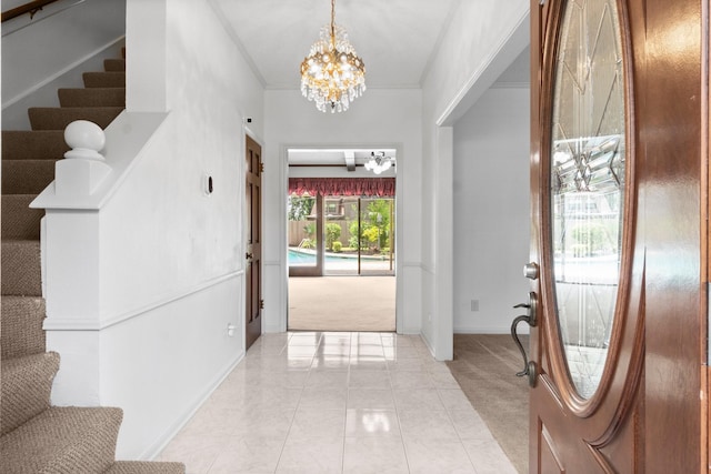 6623 Coral Ridge Rd, Houston, TX 77069 - foyer entrance with light colored carpet, stairs, a chandelier, baseboards, and light tile patterned flooring