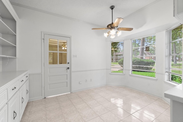 6623 Coral Ridge Rd, Houston, TX 77069 - unfurnished dining area with ceiling fan, healthy amount of natural light, crown molding, and a textured ceiling