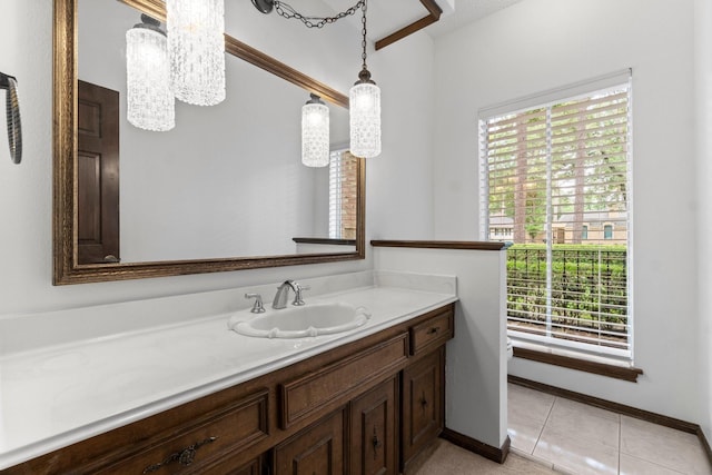 6623 Coral Ridge Rd, Houston, TX 77069 - bathroom featuring vanity, a chandelier, tile patterned flooring, and baseboards