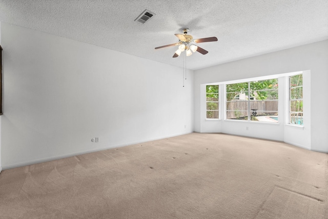 6623 Coral Ridge Rd, Houston, TX 77069 - carpeted spare room with a ceiling fan, a textured ceiling, and baseboards