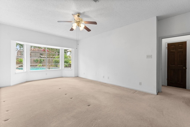 6623 Coral Ridge Rd, Houston, TX 77069 - carpeted spare room featuring a ceiling fan, a textured ceiling, and baseboards