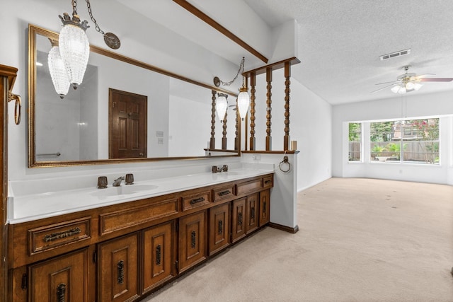 6623 Coral Ridge Rd, Houston, TX 77069 - full bathroom featuring double vanity, a ceiling fan, a textured ceiling, and baseboards